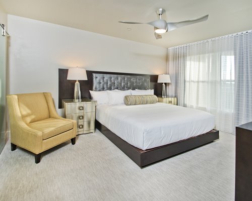 Bedroom with large Window panels at The Reserve at Summer Bay Orlando By Exploria Resorts