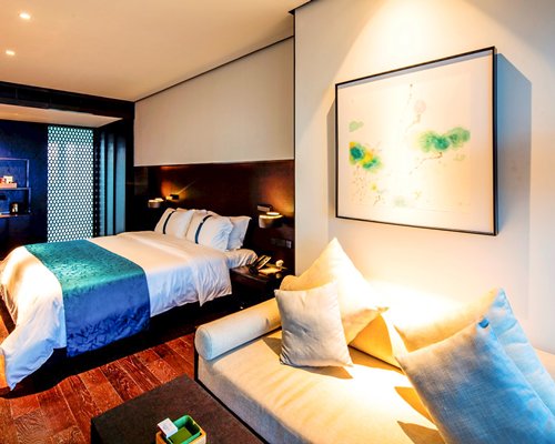A well furnished bedroom with a king bed.