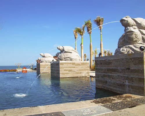 View of water features on an outdoor swimming pool.