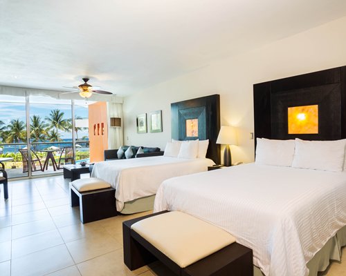 A well furnished bedroom with an outside view.