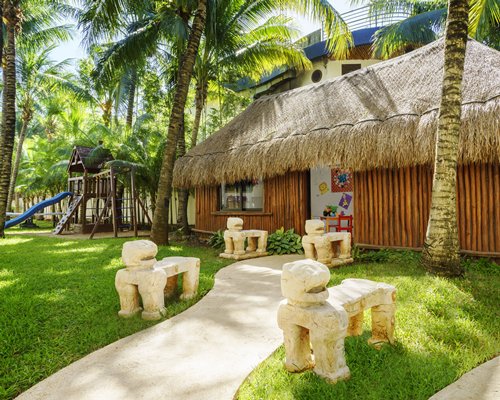 A scenic pathway leading to the resort unit alongside play area.