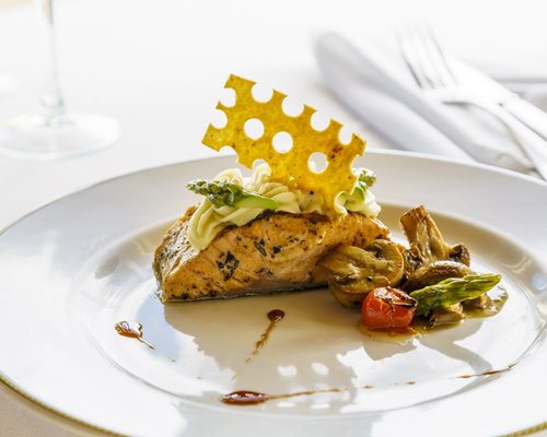 Garnished food on a plate.