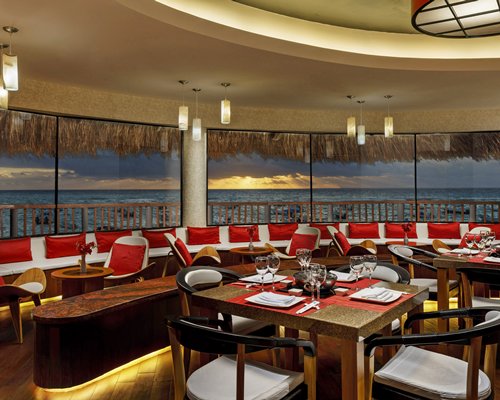 An indoor fine dining restaurant with an outside view.