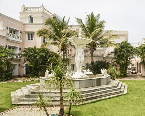 Scenic exterior view of the Club Mahindra Emerald Palms resort with a water fountain.
