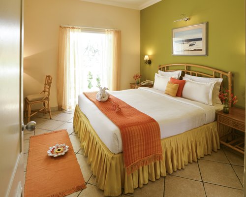 A well furnished bedroom with double bed and outside view.