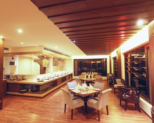 A well furnished indoor restaurant with buffet access.