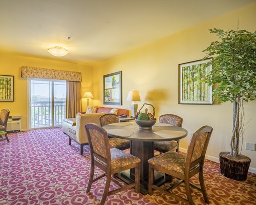 A well furnished living room with pull out sofa.