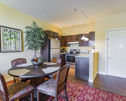 A well furnished living room with dining area and balcony.