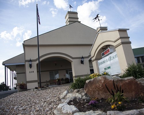 Exterior view of The Retreat of Foxborough with a signboard.