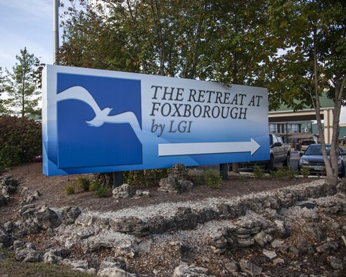 Signboard of The Retreat of Foxborough by LGI alongside a parking lot.