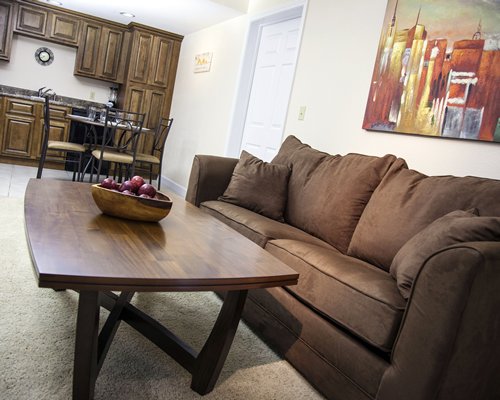 A living room with an open plan kitchen and dining area.