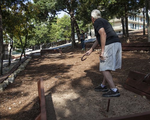 A man playing in an outdoor area.