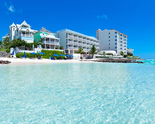 An exterior view of the resort alongside the ocean.
