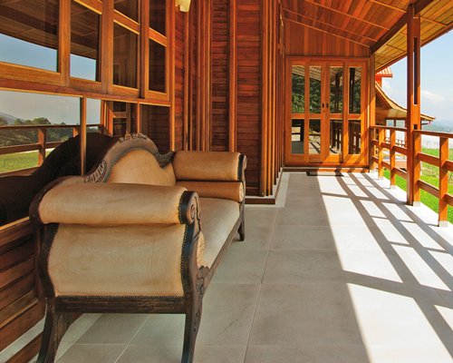 A love seat in a patio.
