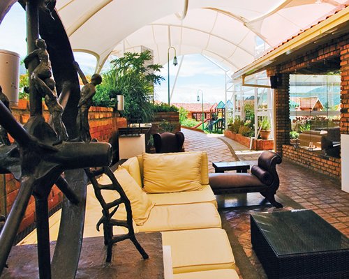 A well furnished indoor lounge area with plants.