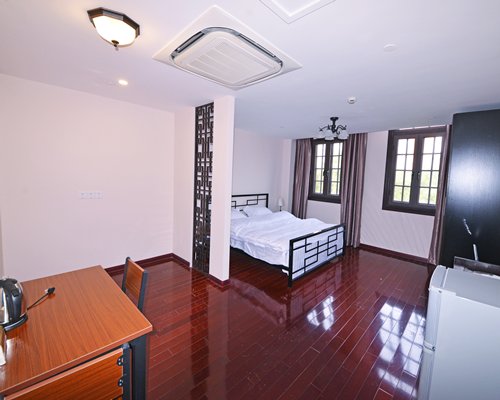 A well furnished bedroom with a television.