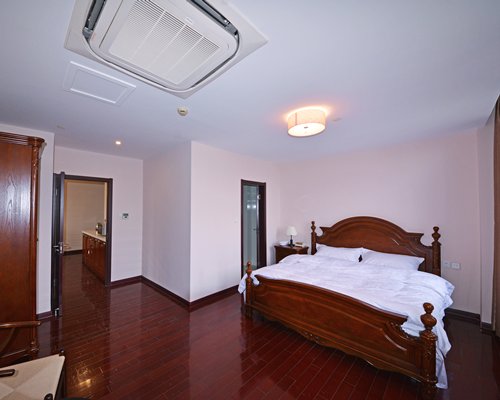 A well furnished bedroom with a king bed.