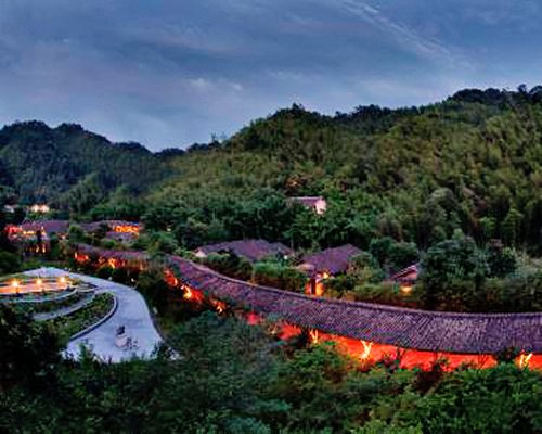 Exterior view of Crosswaters Ecolodge & Spa at a wooded area.