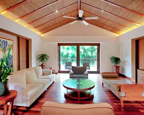 A well furnished living room with sofa bed and patio.