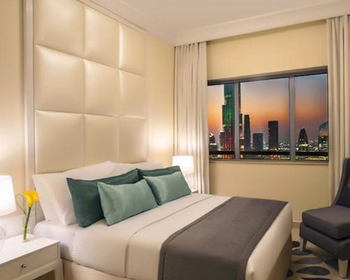 A well furnished bedroom with an outside view.