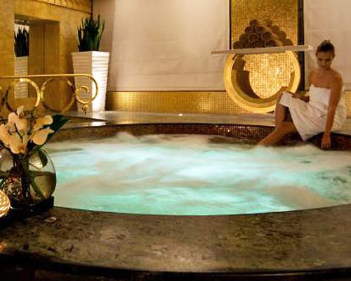 A woman in an indoor hot tub.