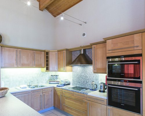 A well equipped kitchen with a microwave oven.