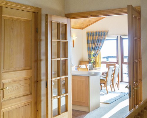 A wooden double door entry way.