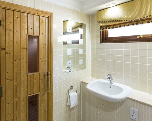 A bathroom with single sink vanity.