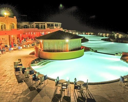 An outdoor swimming pool with poolside bar.