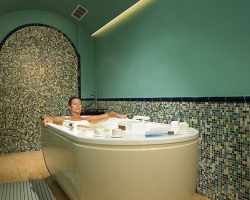 A woman in the indoor bathtub.