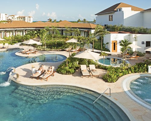 Outdoor swimming pool and hot tubs alongside the resort.
