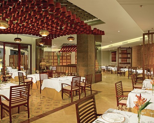 An indoor restaurant at Secrets Playa Mujeres Golf & Spa Resort.