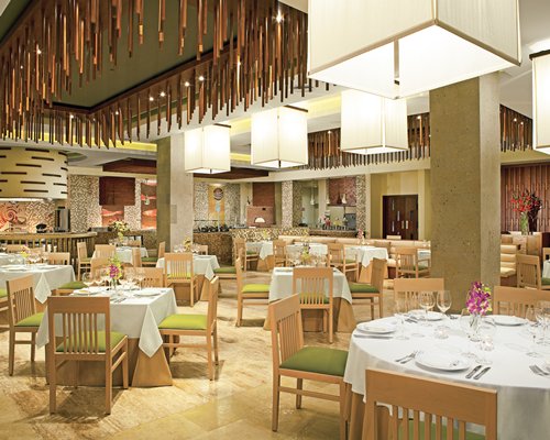 An indoor restaurant at Secrets Playa Mujeres Golf & Spa Resort.