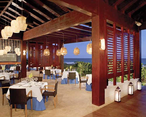 An indoor fine dining restaurant with an outside view.