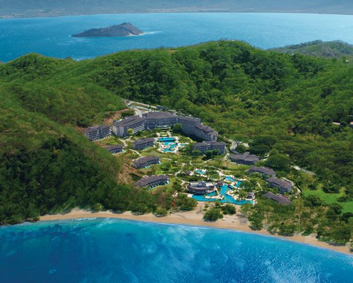 An aerial view of the resort property alongside the ocean.