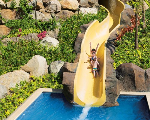 View of kids enjoying in a water slide.