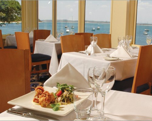 A fine dining restaurant with a view of the water.