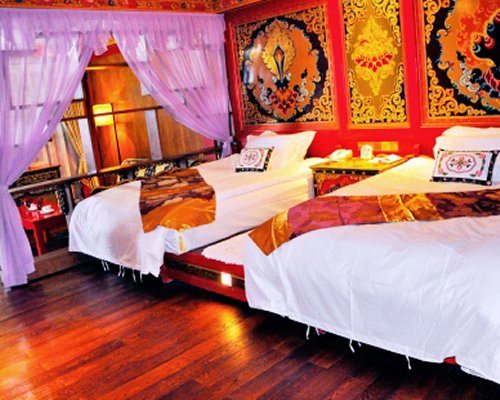 A well furnished bedroom with two beds.