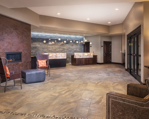 RECEPTION AND LOUNGE AREA AT WYNDHAM PARK CITY WITH FIREPLACE.