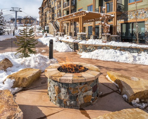 VIEW OF THE CAMPFIRE ALONGSIDE THE RESORT DURING WINTER.