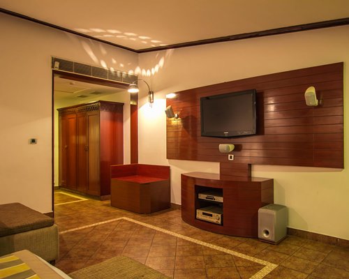 A well furnished indoor room with a television.