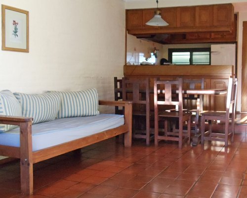 A well furnished living room with an open plan kitchen.