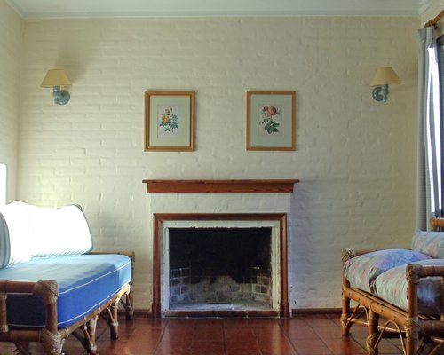 A well furnished living room with a fireplace.