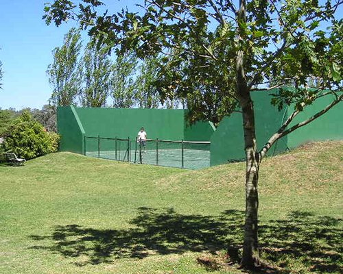 Scenic view of an outdoor tennis court.