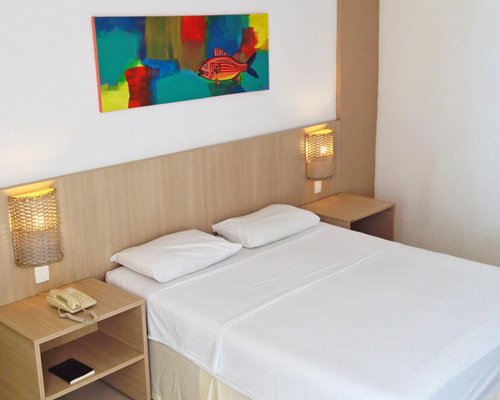 A well furnished bedroom with a double bed.