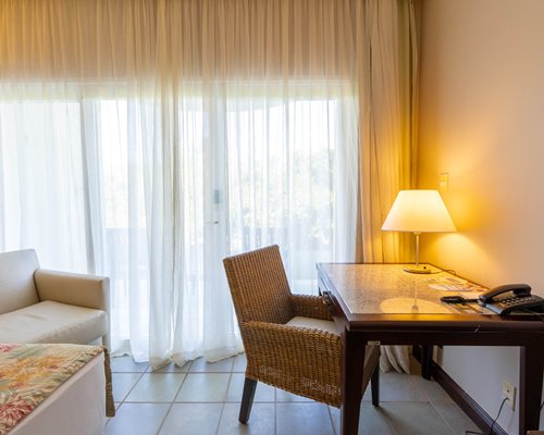 A well furnished bedroom with a queen bed.