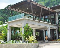 Entrance of Sea Pearl Villas Resort surrounded by trees.