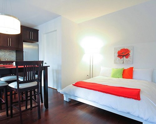 A well furnished bedroom with dining area.