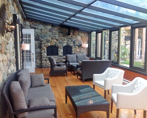Lounge area with a fireplace and outside view.