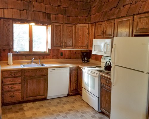 A well equipped kitchen with a microwave oven.